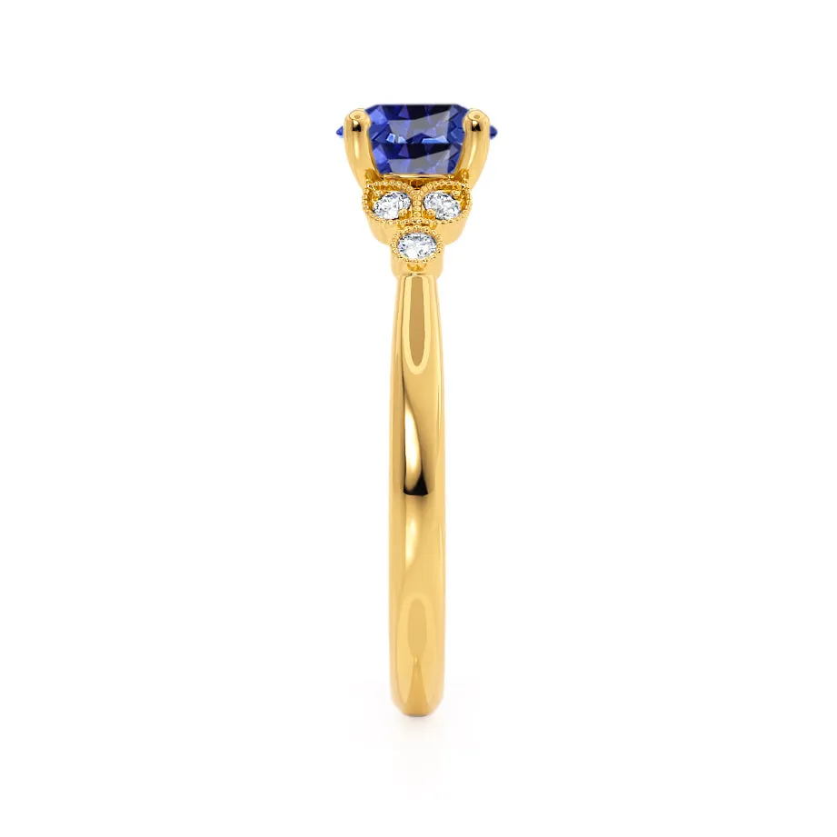 DELILAH - Chatham® Round Blue Sapphire 18k Yellow Gold Shoulder Set Ring